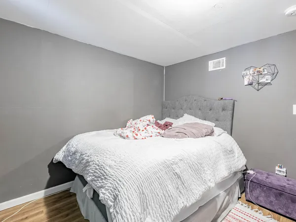 a bedroom with a bed and a table