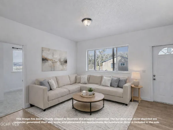 a living room with furniture and a window