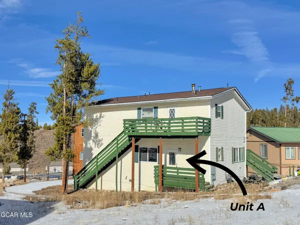 a view of a house with a tree