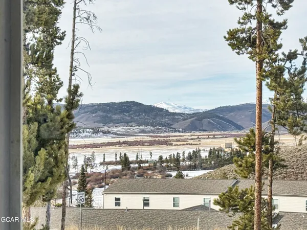a view of ocean with a mountain