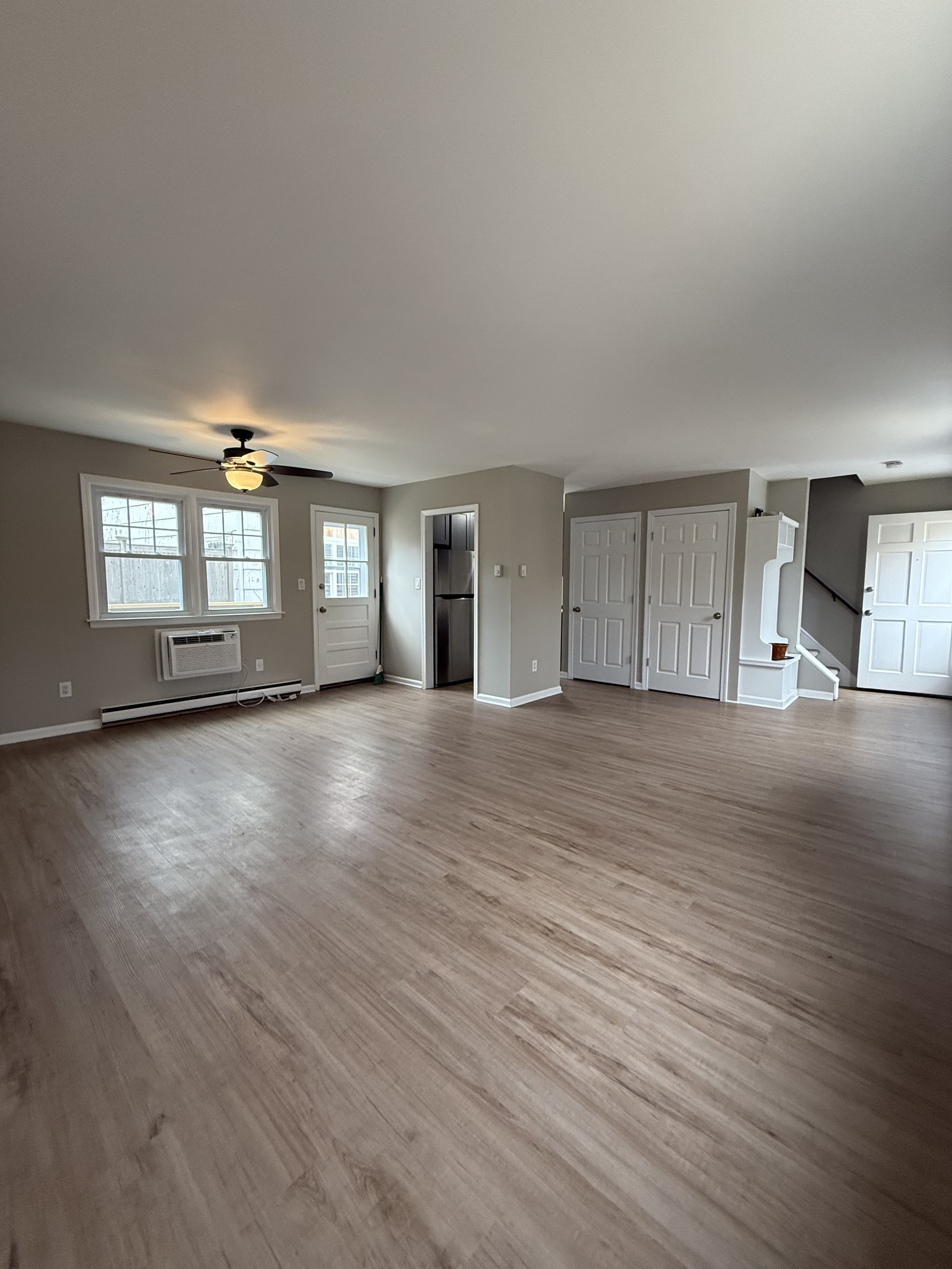 2 Frances Avenue, Unit 2 Norwalk, CT 06854 - Photo 4 of 9 a view of empty room with wooden floor and fan