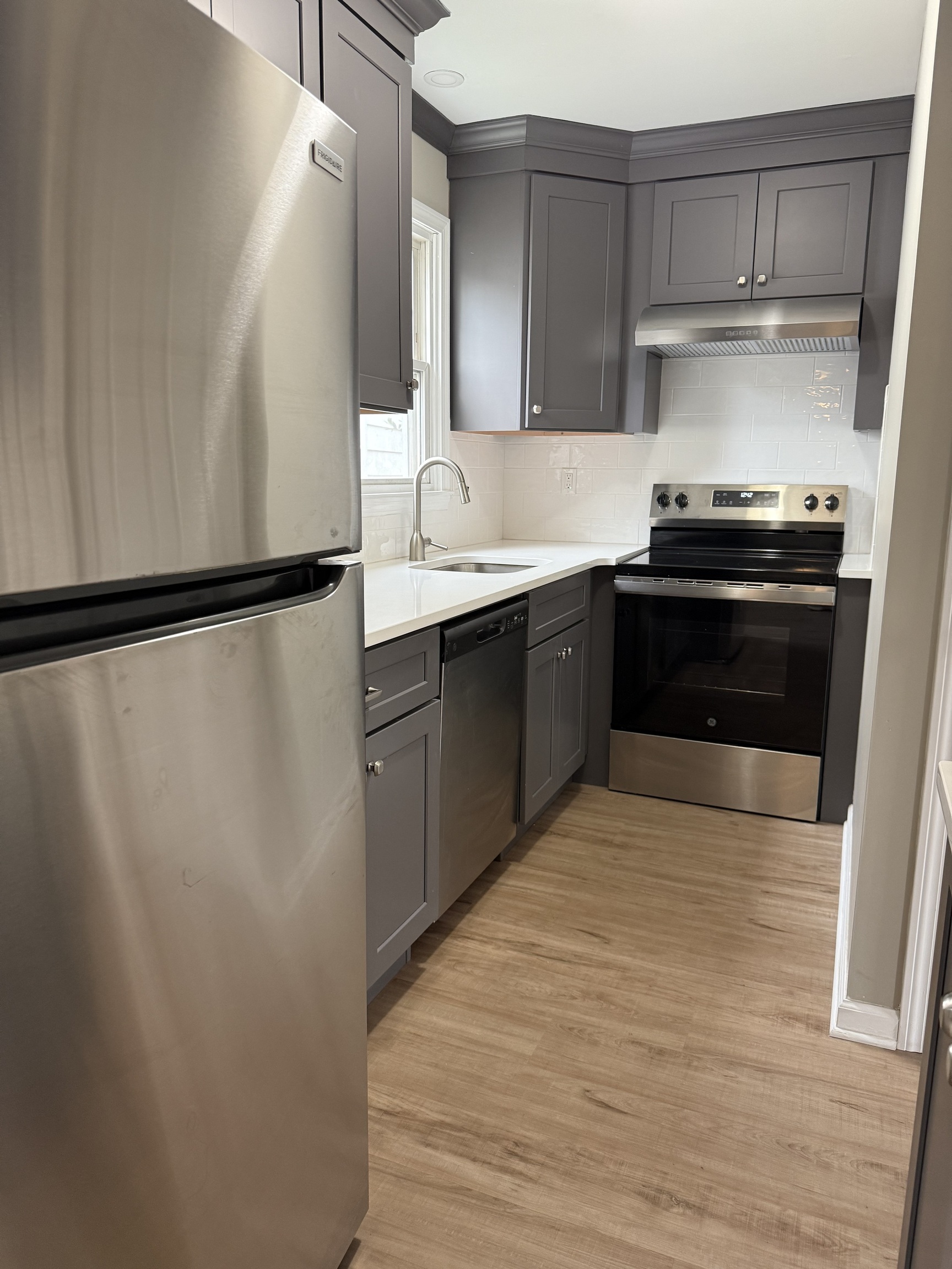 2 Frances Avenue, Unit 2 Norwalk, CT 06854 - Photo 5 of 9 a kitchen with stainless steel appliances a refrigerator and a sink