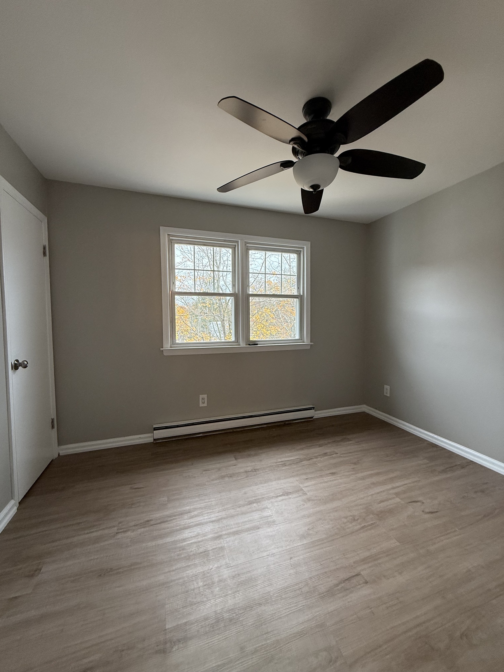 2 Frances Avenue, Unit 2 Norwalk, CT 06854 - Photo 8 of 9 wooden floor in an empty room with a window