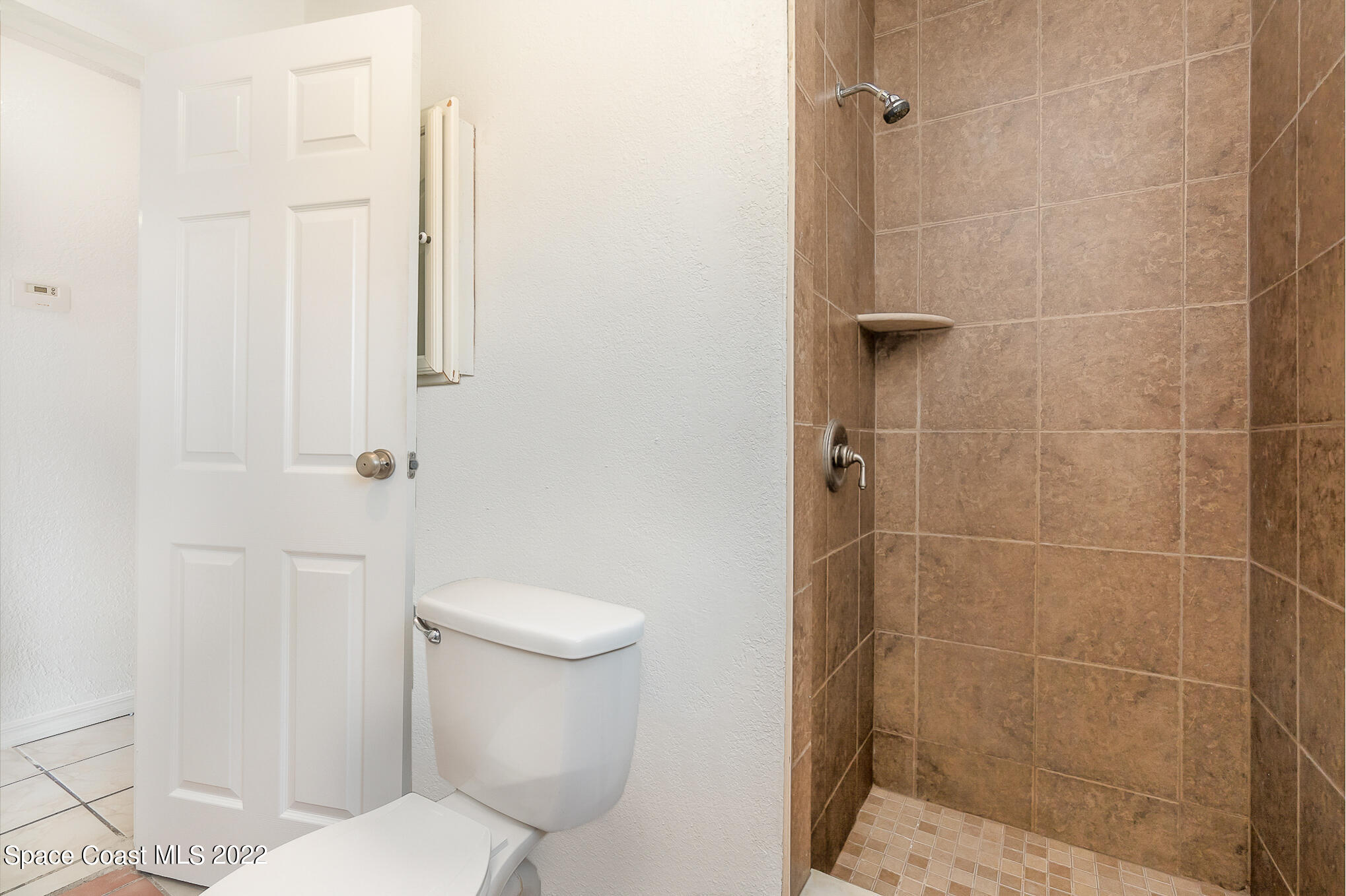 150 Capron Road Cocoa, FL 32927 - Photo 14 of 20 a white toilet sitting next to a bathroom sink