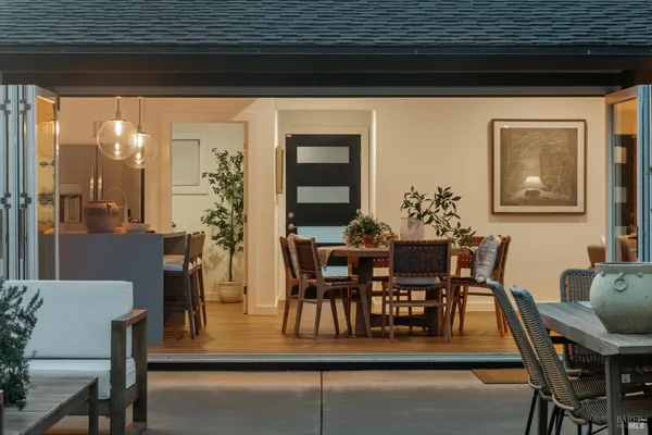 a view of a dining room with furniture and window