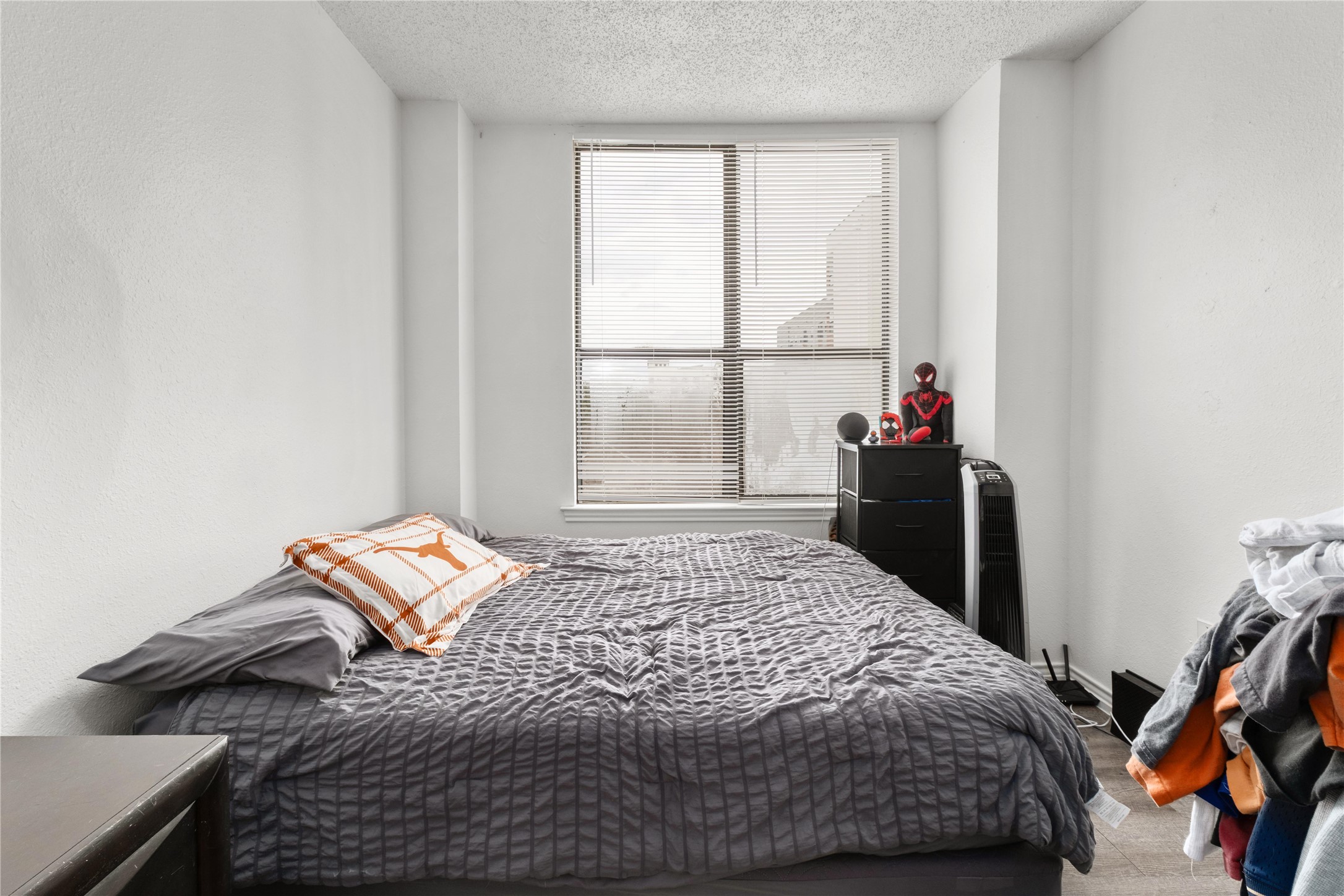 2409 Leon Street, Unit 307 Austin, TX 78705 - Photo 19 of 23 a bedroom with a bed and a window