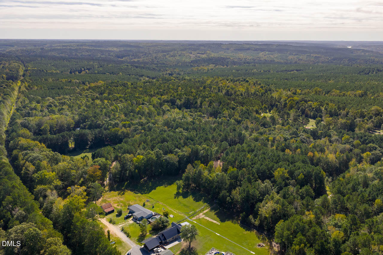 262 Ellis Road Moncure, NC 27559 - Photo 2 of 29 an aerial view of a house with a yard