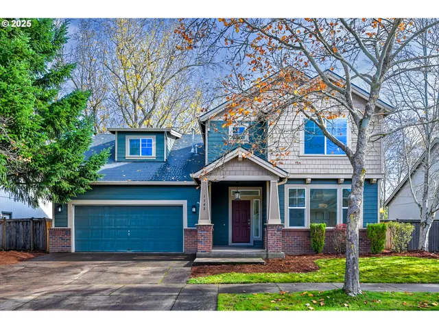 a living room with furniture a fireplace and a large window