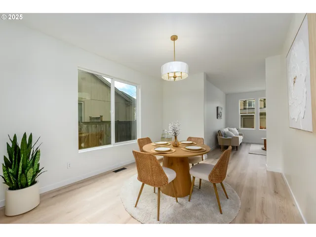 a kitchen with a sink window and cabinets
