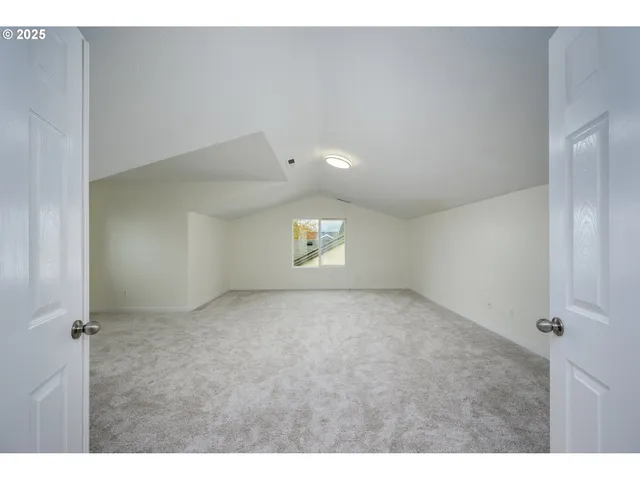 a dining room with a table and chairs