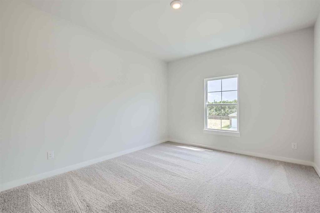 736 Vineyard Way Forney, TX 75126 - Photo 19 of 40 an empty room with a window