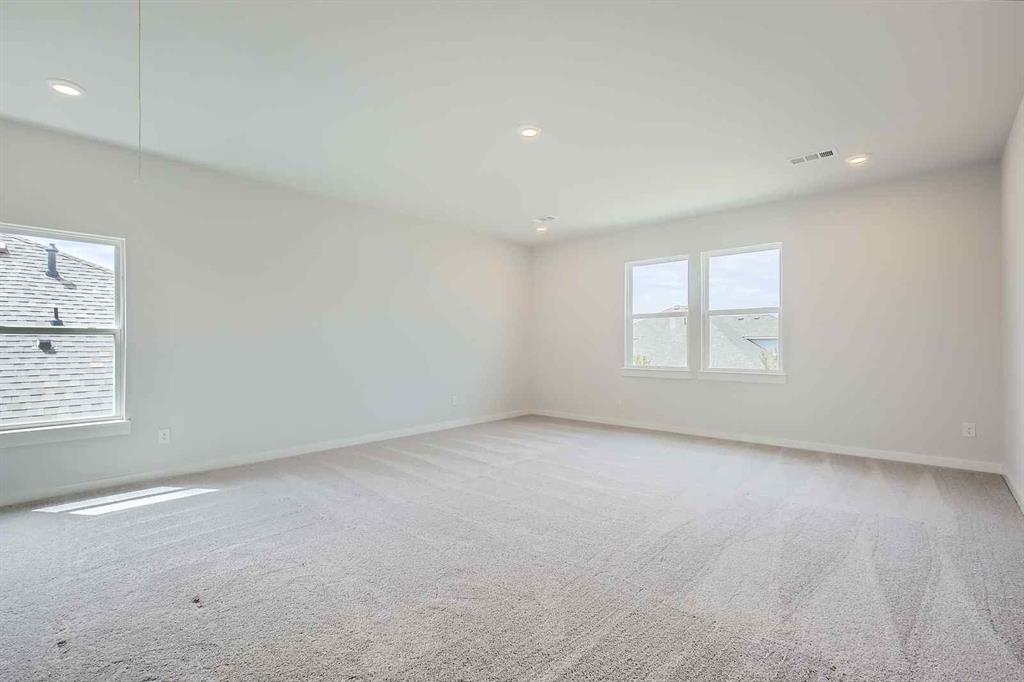 736 Vineyard Way Forney, TX 75126 - Photo 22 of 40 an empty room with a window