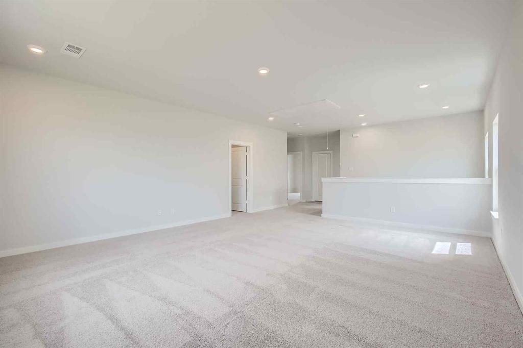 736 Vineyard Way Forney, TX 75126 - Photo 23 of 40 a view of an empty room