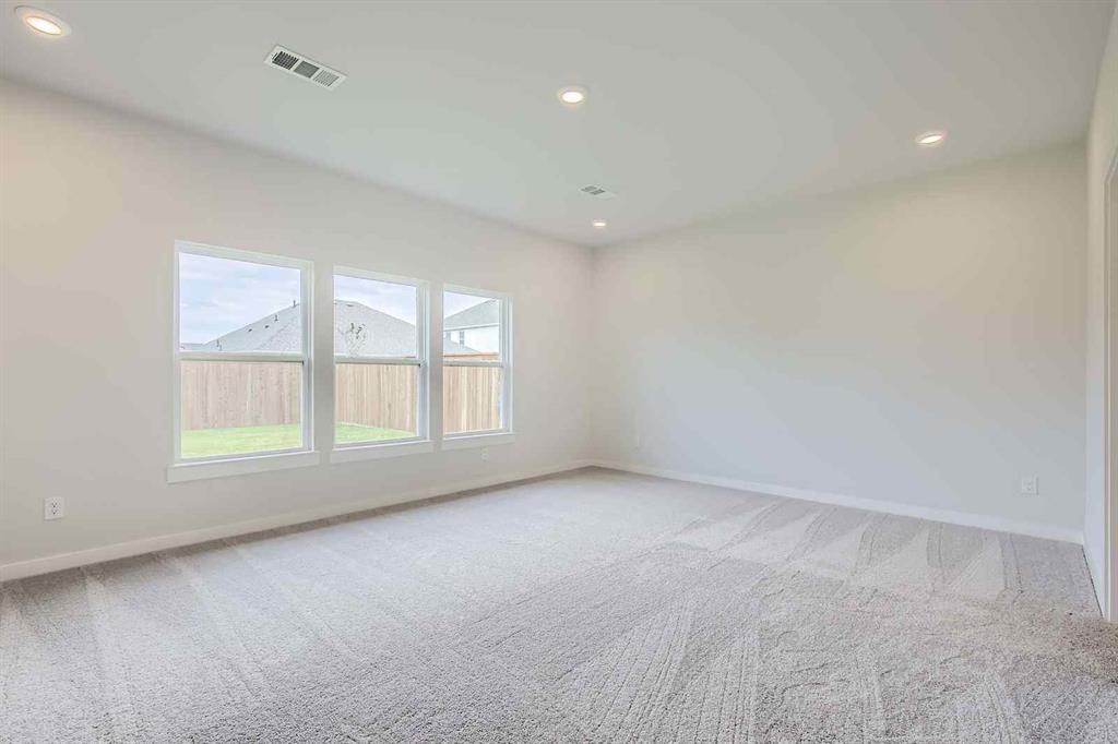 736 Vineyard Way Forney, TX 75126 - Photo 10 of 40 an empty room with a window