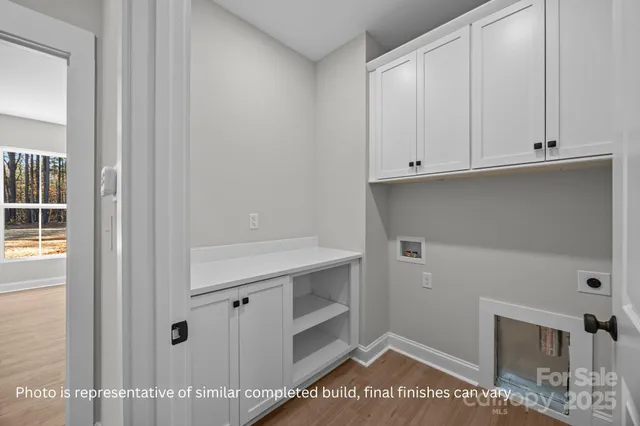 a bathroom with a double vanity sink toilet and mirror