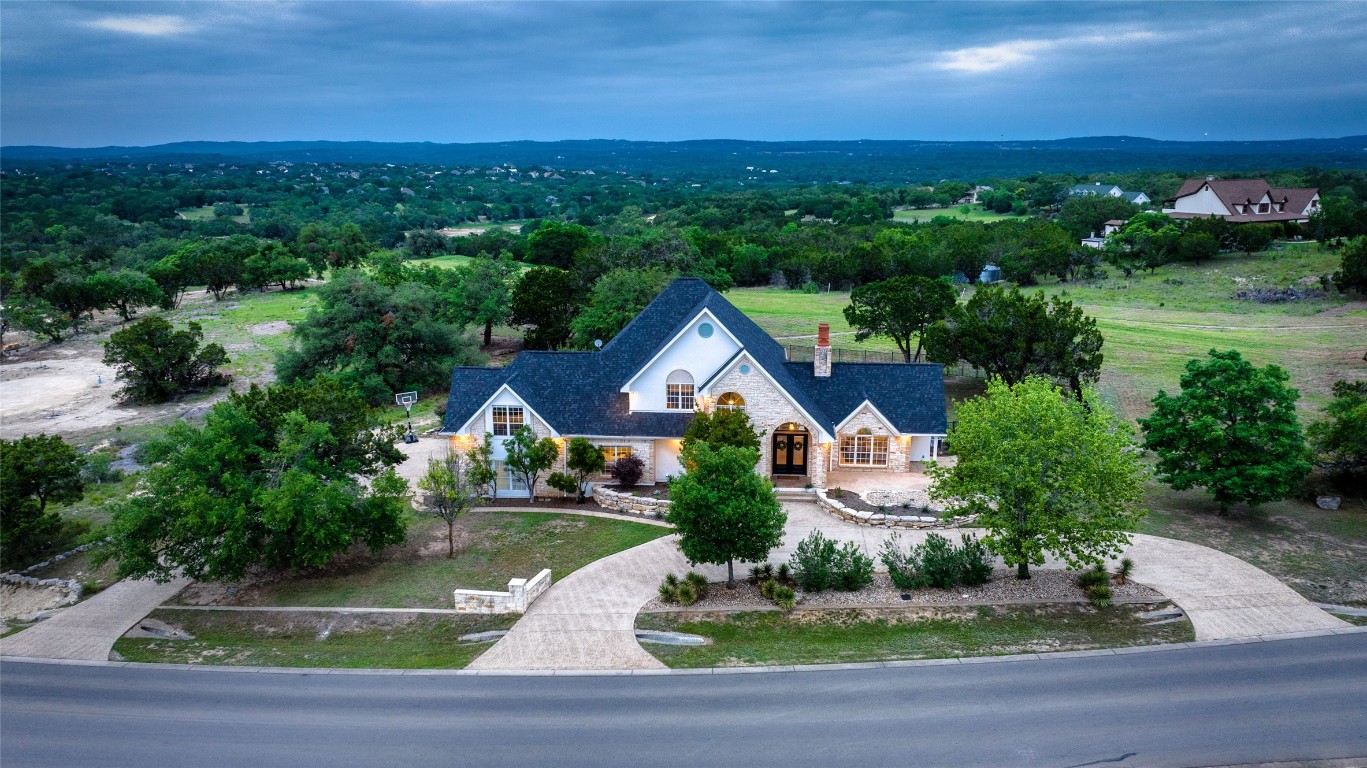 an aerial view of house with yard