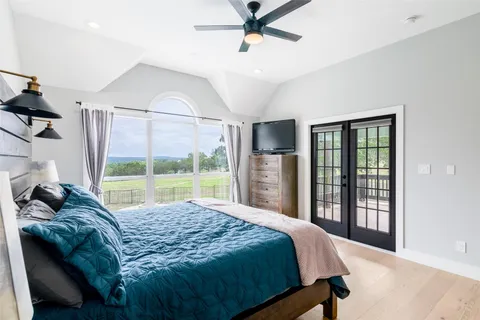 a view of entryway with furniture and wooden floor