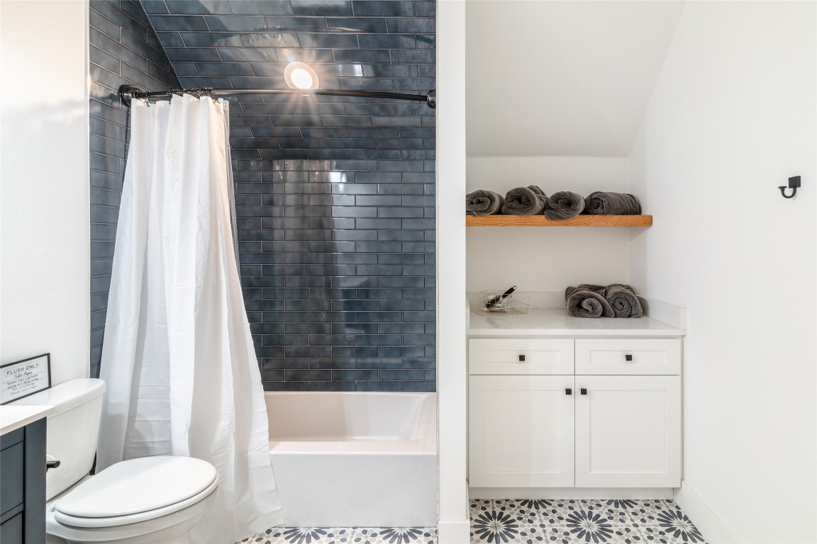 31 West Valley Spring Road Wimberley, TX 78676 - Photo 25 of 38 a bathroom with a bathtub and a shower