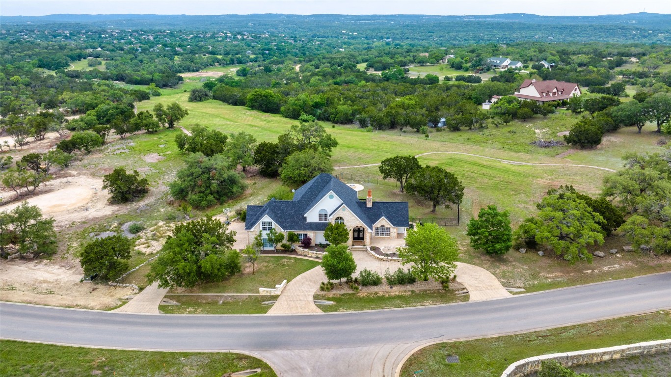 31 West Valley Spring Road Wimberley, TX 78676 - Photo 4 of 38 an aerial view of residential houses with outdoor space and trees