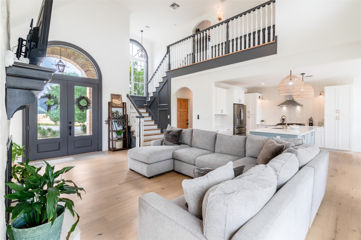 31 West Valley Spring Road Wimberley, TX 78676 - Photo 7 of 38 a living room with furniture and a potted plant