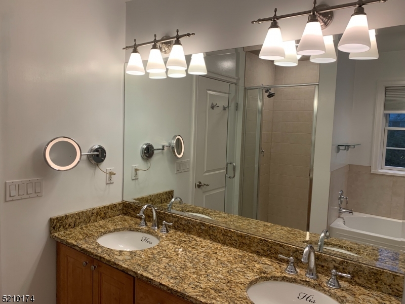 453 Springfield Avenue Berkeley Heights, NJ 07922 - Photo 12 of 13 a bathroom with a granite countertop sink and a mirror