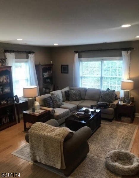 453 Springfield Avenue Berkeley Heights, NJ 07922 - Photo 2 of 13 a living room with furniture and a large window