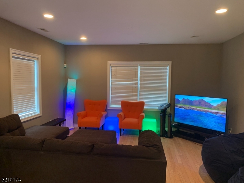 453 Springfield Avenue Berkeley Heights, NJ 07922 - Photo 3 of 13 a bedroom with furniture and a window