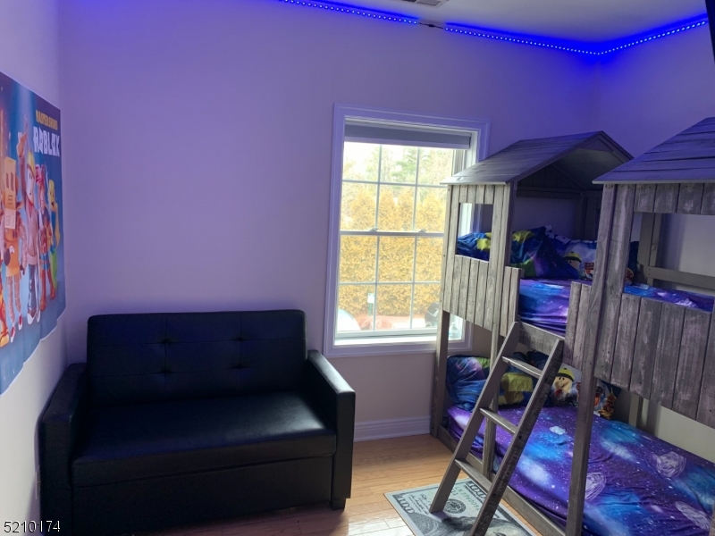 453 Springfield Avenue Berkeley Heights, NJ 07922 - Photo 9 of 13 a living room with furniture and a window