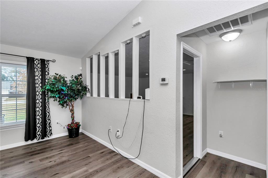 14 Maple Run Ocala, FL 34472 - Photo 13 of 43 a view of entryway with wooden floor and stairs