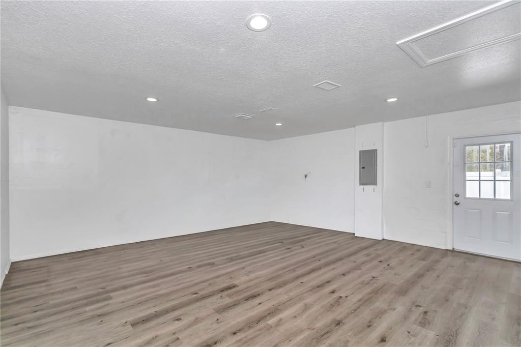 14 Maple Run Ocala, FL 34472 - Photo 16 of 43 an empty room with wooden floor and windows