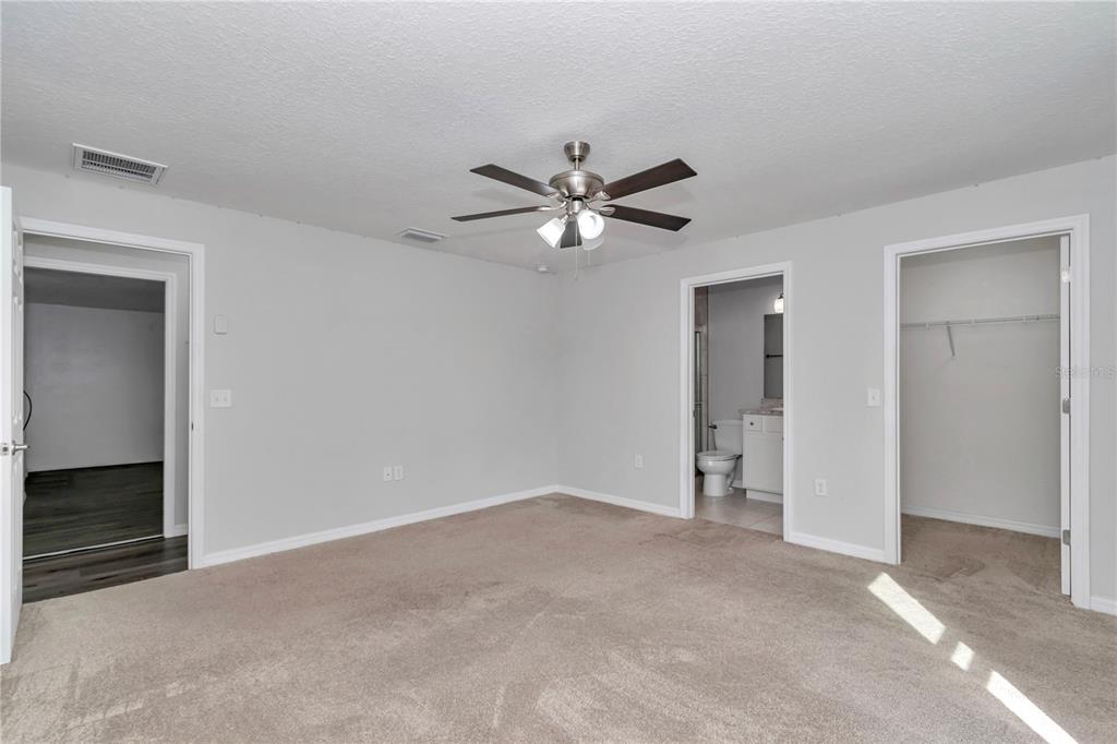 14 Maple Run Ocala, FL 34472 - Photo 24 of 43 an empty room with closet and a ceiling fan