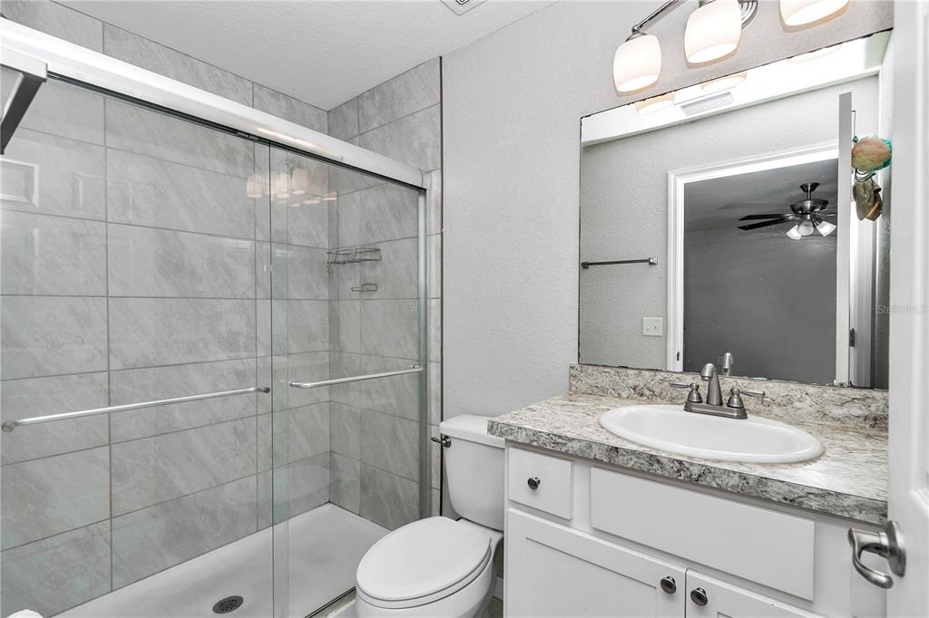 14 Maple Run Ocala, FL 34472 - Photo 26 of 43 a bathroom with a granite countertop sink a toilet and shower