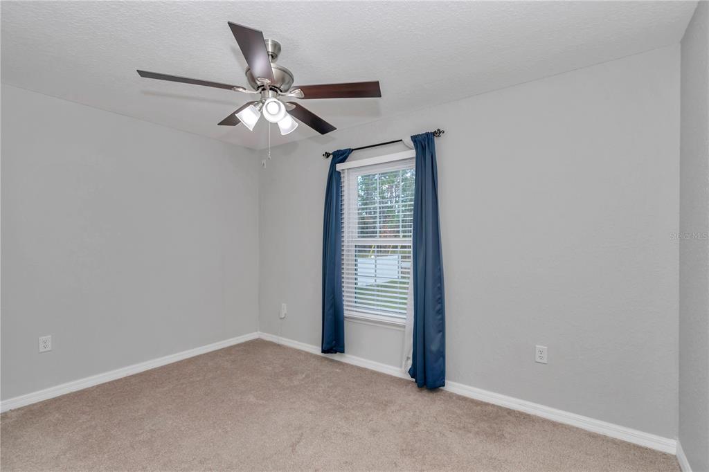 14 Maple Run Ocala, FL 34472 - Photo 28 of 43 an empty room with closet and windows
