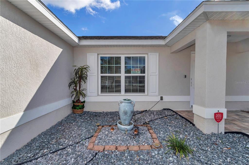 14 Maple Run Ocala, FL 34472 - Photo 4 of 43 a front view of a house with a yard