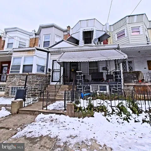 a front view of a houses on the street