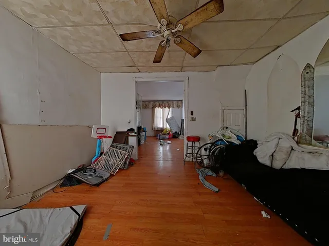 a room with furniture a rug and gym equipment