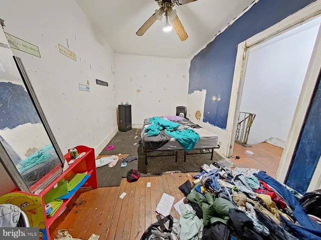 a bedroom with bed and window