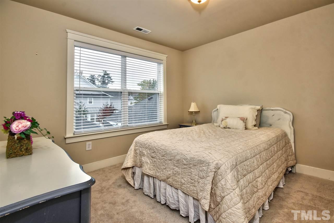 4523 All Points View Way Raleigh, NC 27614 - Photo 14 of 21 a bedroom with a bed and a table