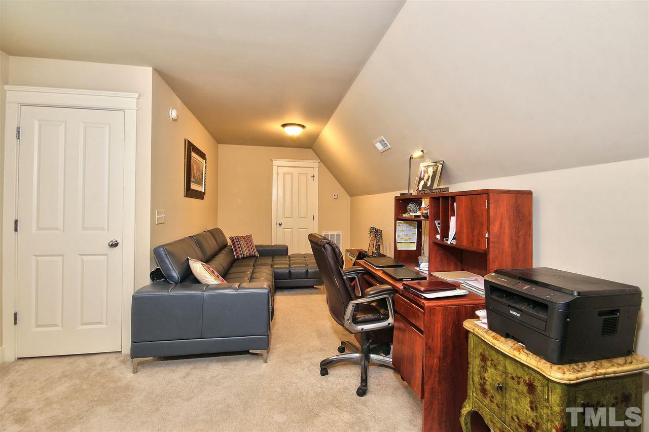4523 All Points View Way Raleigh, NC 27614 - Photo 17 of 21 a living room with furniture and a flat screen tv