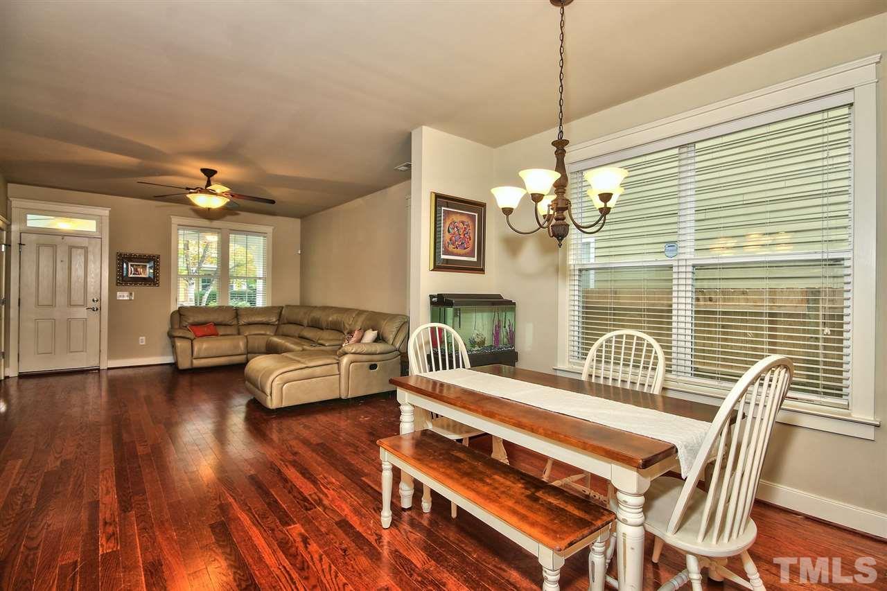 4523 All Points View Way Raleigh, NC 27614 - Photo 7 of 21 a living room with furniture and a chandelier