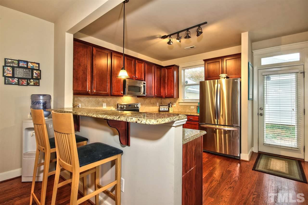 4523 All Points View Way Raleigh, NC 27614 - Photo 10 of 21 a kitchen with a refrigerator a sink and cabinets