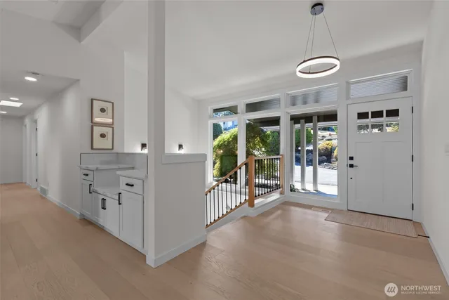 a view of a livingroom with furniture wooden floor and window