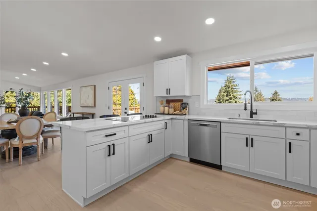 a kitchen with sink and cabinets