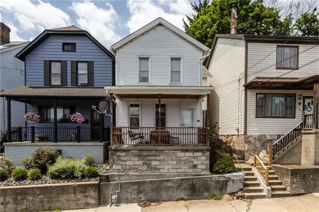 a front view of a house with a porch