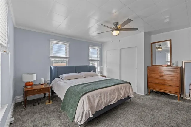 a living room with a couch and a bookshelf
