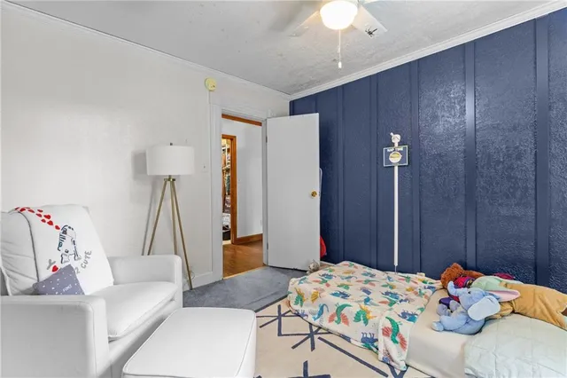 a bathroom with a sink a toilet a mirror and a window