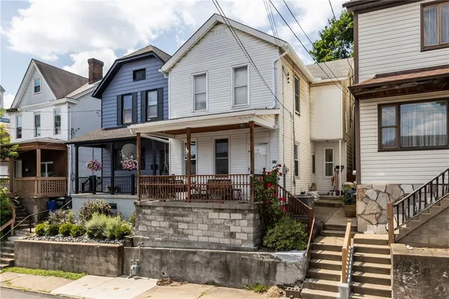 a front view of a house with a porch