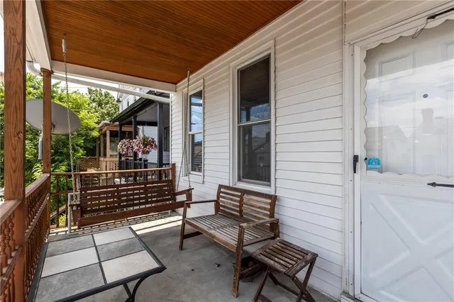 a view of a two chairs and table in the balcony