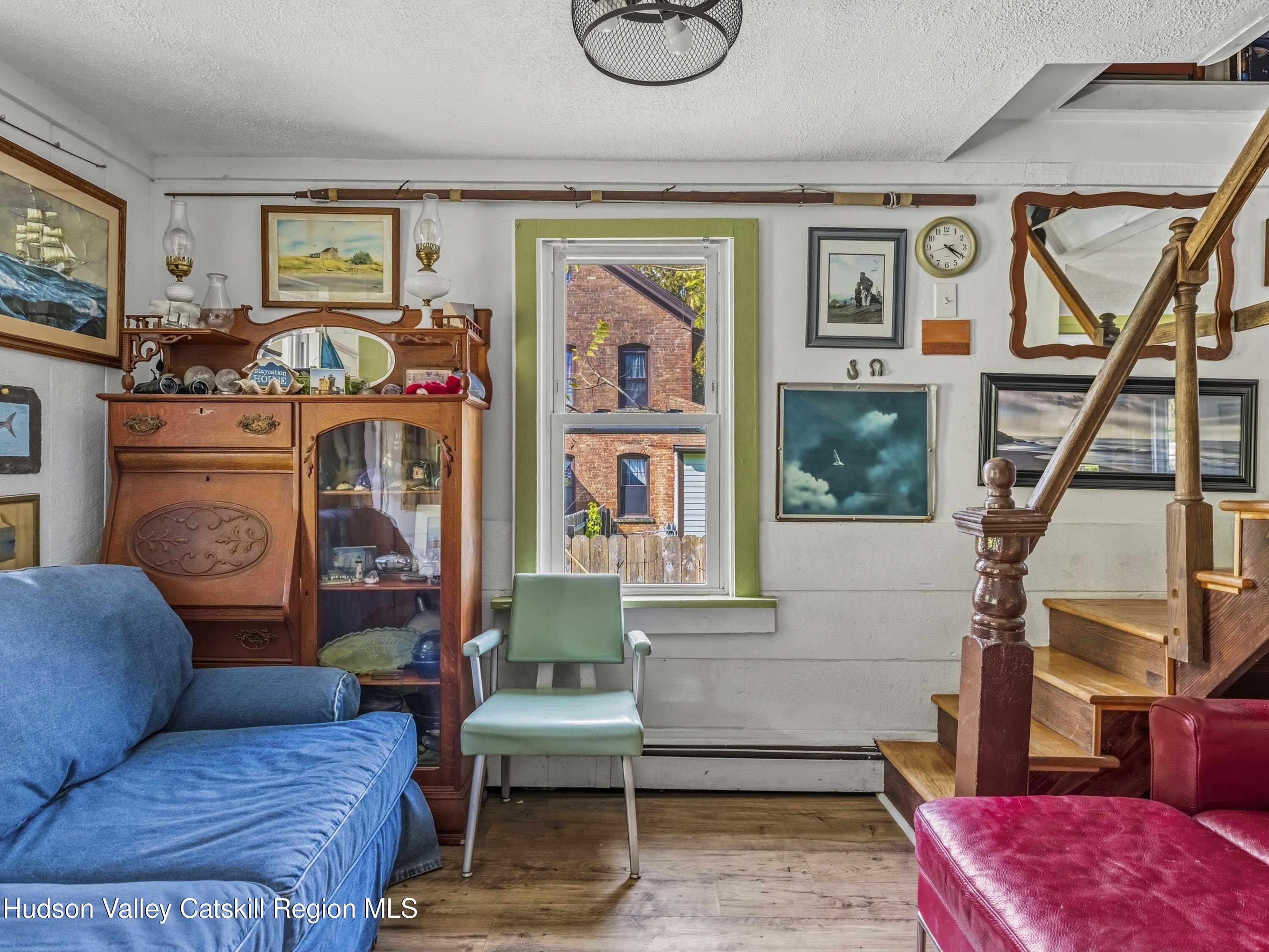 311 Spring Street Port Ewen, NY 12466 - Photo 11 of 45 a living room with furniture and a window