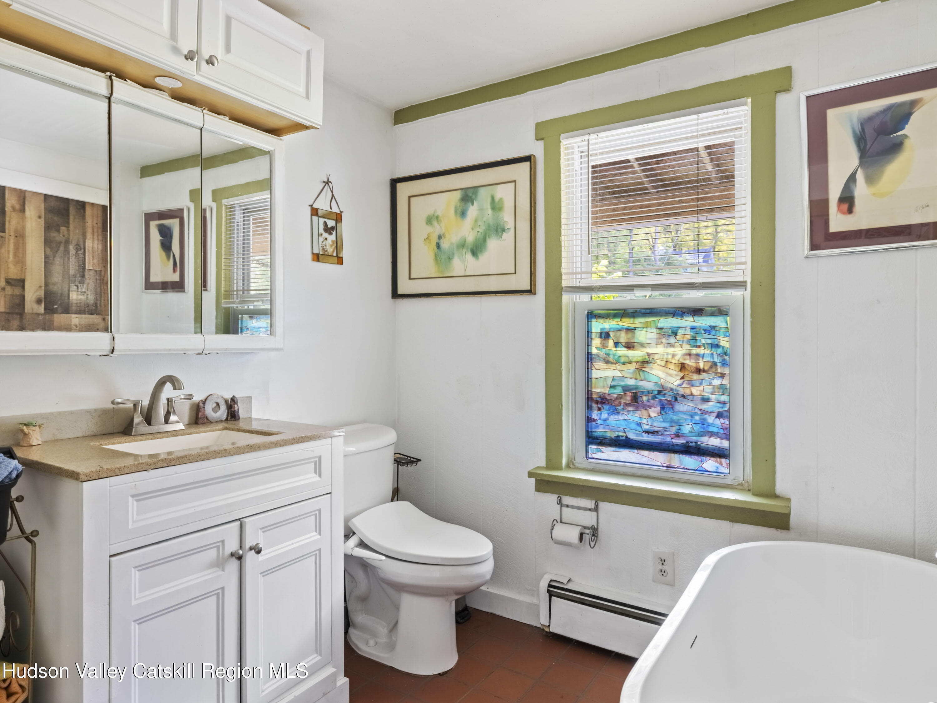 311 Spring Street Port Ewen, NY 12466 - Photo 22 of 45 a bathroom with a toilet a sink and a window
